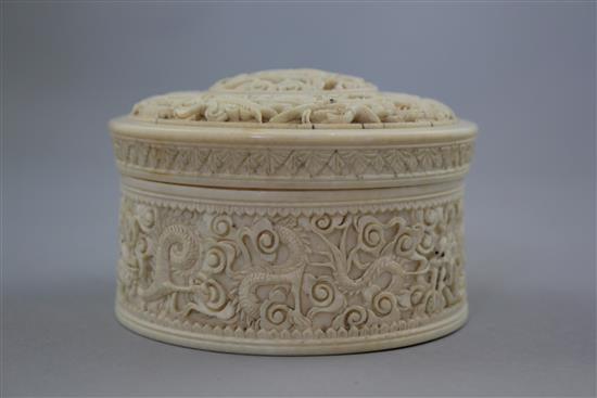 A Chinese ivory dragon drum shaped box and cover, early 20th century, diam. 10.5cm